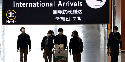 Passengers walk at the lobby for the international arrivals at Kansai International Airport in Osaka, western Japan. (Photo | AP)