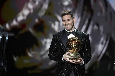Argentina and PSG player Lionel Messi reacts after winning 2021 Ballon d'Or trophy at Theatre du Chatelet, in Paris, Monday, Nov. 29, 2021.  (Photo | AP)