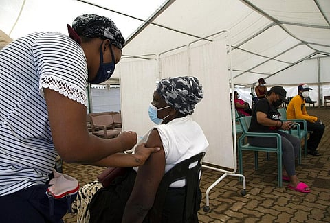 A woman receives a dose of a COVID-19 vaccine at a center, in Soweto, South Africa, Monday, Nov. 29, 2021. (Photo | AP)