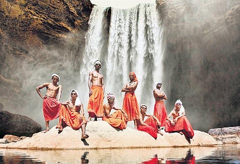A Gussadi tribesman performing a sacred ritual around a fire