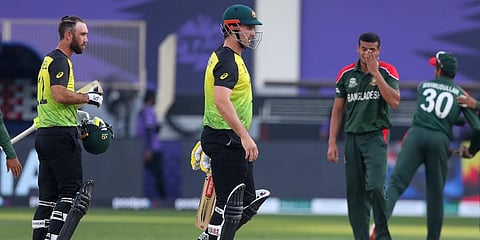 Australia's Glenn Maxwell, left, and teammate Mitch Marsh react after defeating Bangladesh by eight wickets during the Cricket Twenty20 World Cup match in Dubai, UAE, Nov. 4, 2021. (Photo | AP)