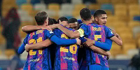 Barcelona players celebrate at the end of the Champions League group E soccer match between Dynamo Kyiv and Barcelona at the Olimpiyskiy Stadium in Kyiv, Ukraine, Nov. 2, 2021. (Photo | AP)