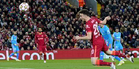 Liverpool's Diogo Jota heads the ball to score a goal during a Champions League match against Atletico Madrid. (Photo| AP)