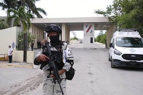 Government forces guard the entrance of hotel after an armed confrontation near Puerto Morelos, Mexico (Photo |AP)