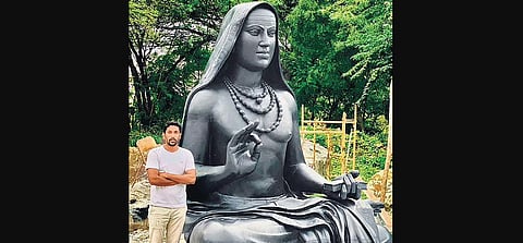 Sculptor Arun Yogiraj stands with the statue of Adi Shankaracharya. (Photo| EPS)