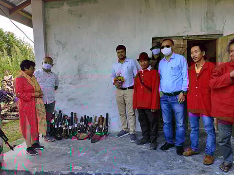 “Gaon Buras” taking a pledge to make their Thamiyang village drug-free in the next few months. District Magistrate Devansh Yadav (third from left) and opium pipes, to be disposed of, are also seen.
