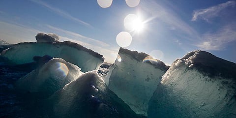 Broken blocks of sea ice emerge from under the hull of the Finnish icebreaker MSV Nordica as it sails through the Victoria Strait while traversing the Arctic's Northwest Passage. (Photo | AP)