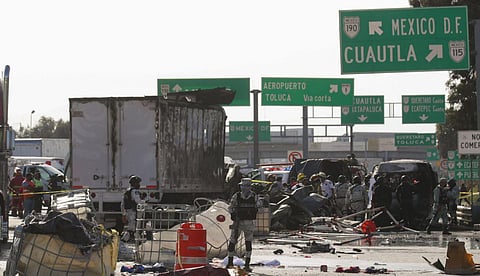 National Guard officers and rescue workers work the scene of an accident involving multiple vehicles, in Chalco (Photo | AP)