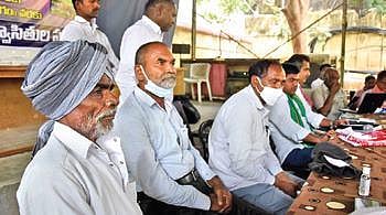 Activists of ‘Telangana Bhoo Nirvasithula Sangham’ at a meeting in Hyderabad on Sunday. (Photo | RVK Rao)