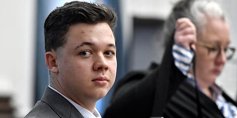 Kyle Rittenhouse looks back at the gallery in the courtroom as the room is let go for an afternoon break at the Kenosha County Courthouse in Kenosha. (Photo | AP)