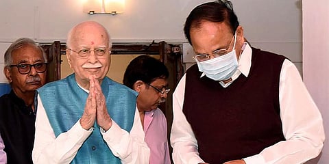 BJP leader LK Advani accompanied by Vice President M Venkaiah Naidu greets the guests on his 94th birthday at his residence in New Delhi. (Photo | ANI)