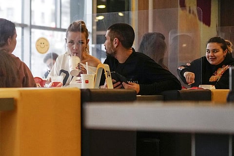 People have a meal in a restaurant in Moscow, Russia, Monday, Nov. 8, 2021. (Photo | AP)