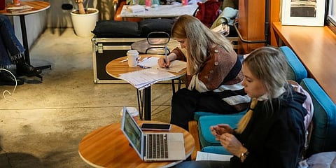 Visitors sit inside a cafe in Moscow, Russia. (Photo | AP)