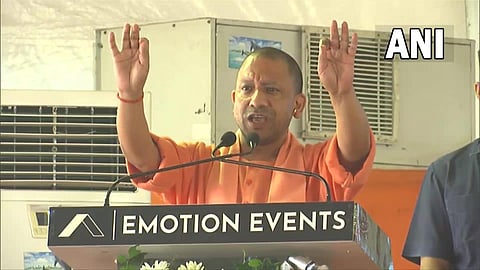 UP CM Yogi addressing a public rally in Baduan on Tuesday. (Photo | Twitter/ANI)