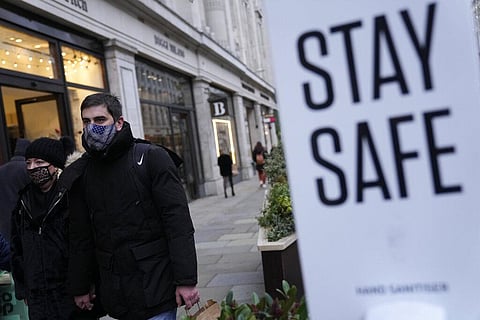 Pedestrians wearing face masks against the coronavirus walk along Regent Street in London, Tuesday, Nov. 30, 2021. (Photo | AP)