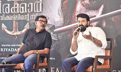 Actor Mohanlal addressing the media along with director Priyadarshan in Kochi on Tuesday | Albin Mathew