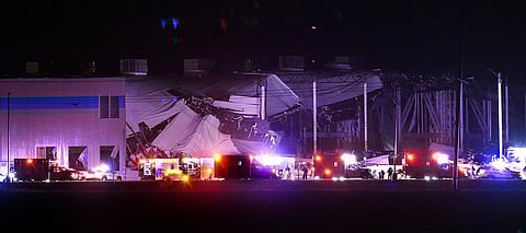 The Amazon distribution center is partially collapsed after being hit by a tornado (Photo | AP)