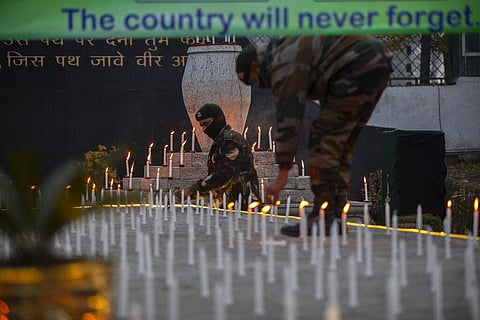 Indian army soldiers light candles to offer tributes to military chief, Gen. Bipin Rawat at an army base in Srinagar. (Photo | AP)