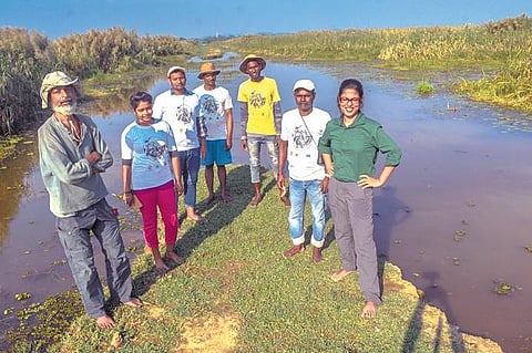 Partha Dey (left) and Tiasa Adhya (right) with members of Chilika Adrabhumi Sangrakshan Committee. (Photo | Biswanath Swain/EPS)
