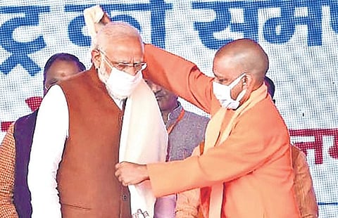 PM Narendra Modi is greeted by UP CM Yogi Adityanath in Balrampur district. (Photo | PTI)