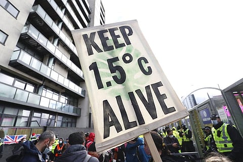 Climate activists take part in a demonstration outside the venue of the COP26 U.N. Climate Summit in Glasgow, Scotland. (Photo | AP)