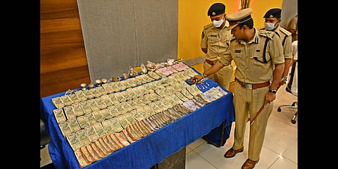 Police commissioner Kanthi Rana Tata takes a look at the money recovered from Attica Gold Company robbery case in Vijayawada on Saturday | Prasant Madugula