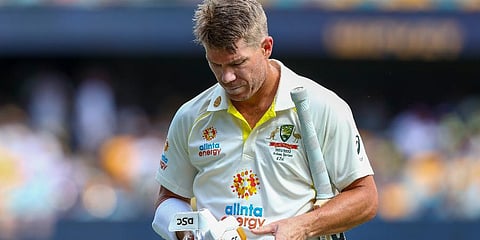 Australia's David Warner reacts as he leaves the field after he was dismissed by England's Ollie Robinson during day two of the first Ashes cricket test at the Gabba, Dec 9, 2021. (Photo | AP)