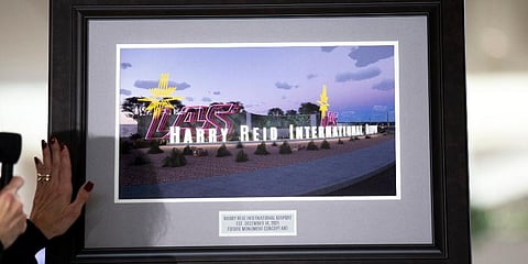 Framed illustration of proposed airport signage during the official renaming of McCarran International Airport to Harry Reid International Airport at the airport in Las Vegas. (Photo | AP)