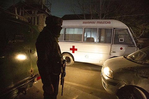An Indian soldier guards as an ambulance passes near the site of an attack on the outskirts of Srinagar. (Photo | AP)