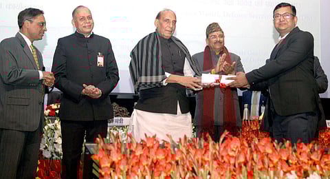 Defence Minister Rajnath Singh gives away Raksha Mantri Awards for Excellence to the personnel of Directorate General Defence Estates. (Photo | PTI)