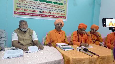 Convenor of All India Vegetarians Federation (AIVF), Dayananda Swamiji along with other swamis and leaders addressing joint press conference in Belagavi on Sunday. (Photo | EPS)