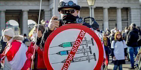 A man takes part in a demonstration against the country's coronavirus restrictions in Vienna, Austria. (Photo | AP)