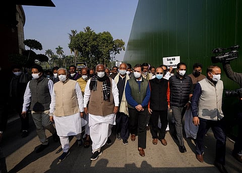 Congress party leader Rahul Gandhi, center, with other opposition party leaders take out a march in the Parliament House, in New Delhi. (Photo | AP)