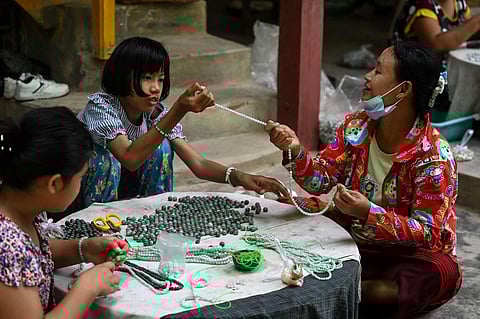 This photo taken on October 10, 2021 shows women working in a jade workshop in Myanmar's Sagaing region. (Photo | AFP)