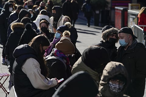 People wait in a long line to get tested for COVID-19 in Times Square, New York, Monday, Dec. 20, 2021. (Photo | AP)
