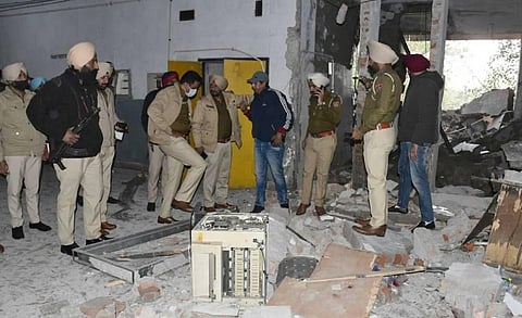 Police inspect the site of an explosion at the District Court complex, in Ludhiana, Thursday, Dec. 23, 2021. (Photo | PTI)