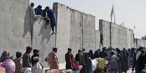People wait to cross into Pakistan at the Afghanistan-Pakistan border crossing point in Spin Boldak. (File photo| AFP)