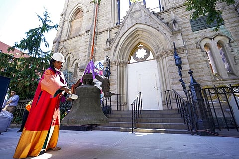 Senior Minister Rev. Jacqueline J. Lewis rings New York's Liberty Bell after a construction crew lowered it from Middle Collegiate Church's bell tower on Wednesday, June 16, 2021. (Photo | AP)