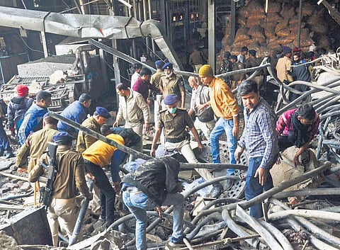 Police inspect the site of boiler explosion in Bihar’s Muzaffarpur on Sunday. (Photo | PTI)