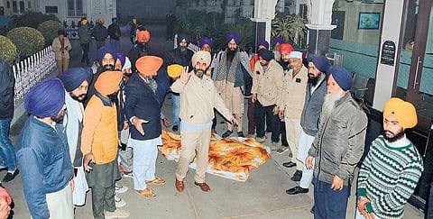 Sikh activists gather outside the Golden Temple after the sacrilege incident. (Photo| PTI)