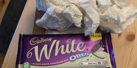 Daniel, who paid 1,045 pounds for the mobile, shared photos of the two 120g white Oreo Dairy Milk bars wrapped in toilet roll. (Photo | Twitter)