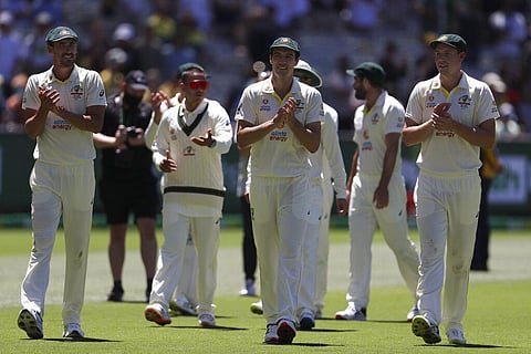 Australia's captain Pat Cummins, center, celebrates with teammates after their win over England on the third day of their cricket test match (Photo | AP)