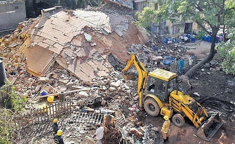 An earthmover clears the debris of the collapsed Tamil Nadu Urban Habitat Development Board building at Tiruvottiyur in Chennai on Monday | R Satish Babu