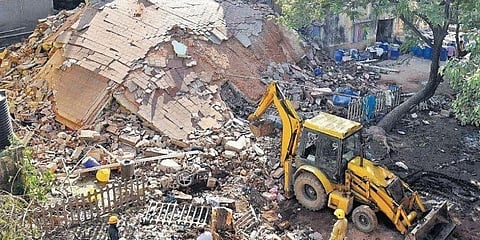 An earthmover clears the debris of the collapsed Tamil Nadu Urban Habitat Development Board building at Tiruvottiyur in Chennai on Monday | R Satish Babu