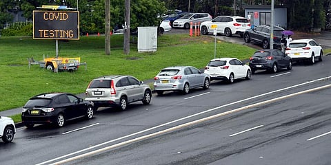 People line up in cars for COVID-19 tests at a clinic in Sydney. (Photo | AP)