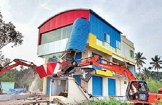 File picture of an illigal structure being razed at Sonashettyhalli in Oct