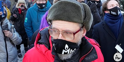 Supporters of the Memorial human rights group wearing face masks with the words 'The Memorial cannot be banned!' gather in front of the Moscow Court in Moscow, Russia. (Photo | AP)