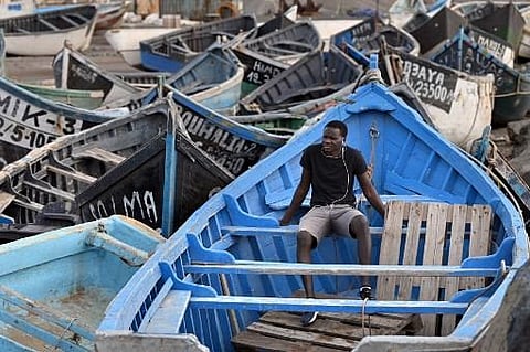 Malian migrant 'Mamadou', 21, who arrived in a boat in August 2020, is pictured in a 'boat cemetery' in Arinaga on November 18, 2021, on the Spanish Canary island of Gran Canaria. (Photo | AFP)