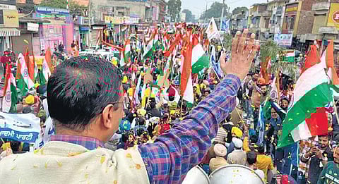 Delhi CM Arvind Kejriwal waves to the crowd during Tiranga Yatra in Pathankot