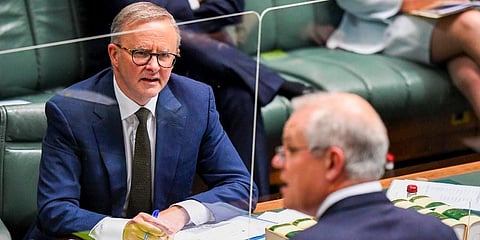Australian Opposition Leader Anthony Albanese, left, watches as Prime Minister, Scott Morrison speaks during House of Representatives Question Time at Parliament House. Dec. 2, 2021. (Photo | AP)